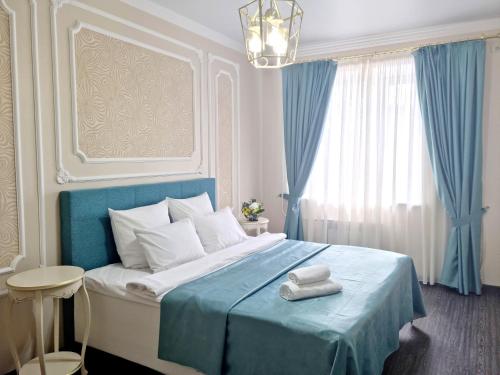 En eller flere senge i et værelse på Golden Park Hotel