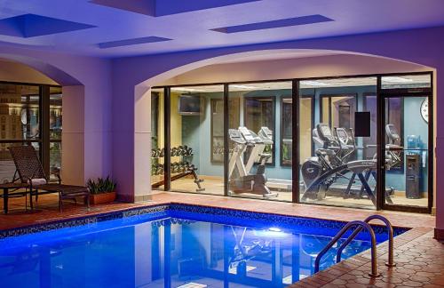 a swimming pool in a house with a gym at Wyndham New Orleans French Quarter in New Orleans