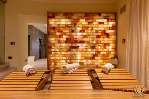 two wooden tables with towels on them in a room at Il Borgo Ospitale - Albergo Diffuso in Rotonda
