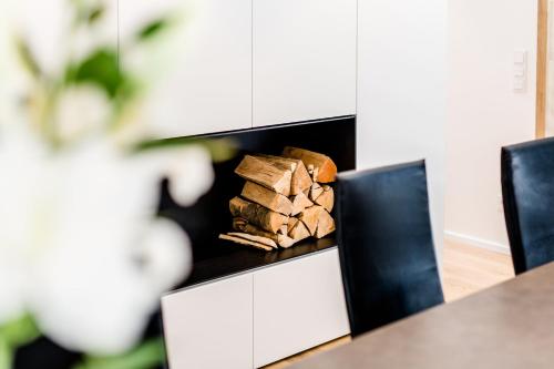 a pile of fire wood sitting on a table at Max Lodging Serviced Apartments in Munich