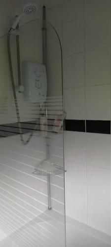 a glass shelf in a bathroom with a sink at great holidays hemsby in Hemsby