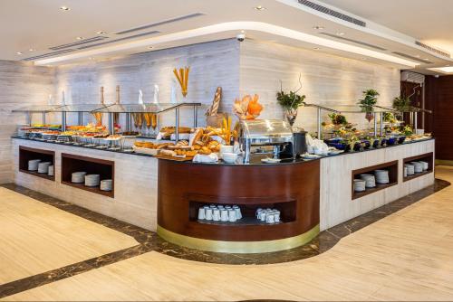 a buffet in a hotel with food on display at Blue Diamond Hotel in Jeddah