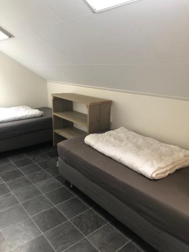 Ένα ή περισσότερα κρεβάτια σε δωμάτιο στο Appartement De Graanzolder aan Zeeuwse kust