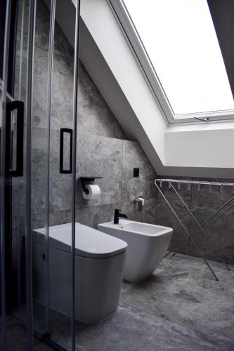 a bathroom with a bath tub and a sink at Apartmány Pod Novou in Mikulov