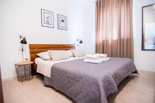 Posteľ alebo postele v izbe v ubytovaní Apartments Up&Up