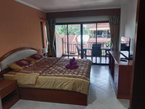 Postel nebo postele na pokoji v ubytování Appartamento Patong Beach, all'interno del Sai Rougn residence