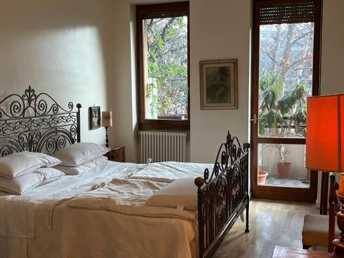a bedroom with a large bed and a window at Milano San Siro Club in Milan
