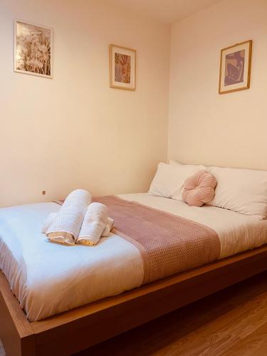 a bedroom with a bed with two pillows on it at 'Woodbury' at stayBOOM in Lancaster