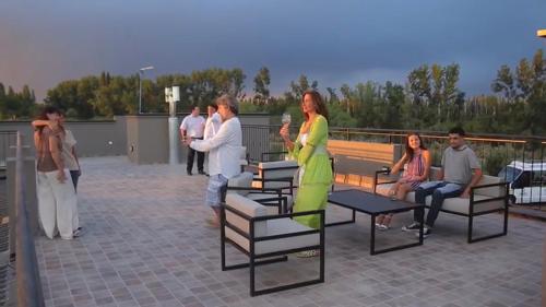 a group of people standing around on a patio at Hotel Boutique Miss Olivos in San Rafael
