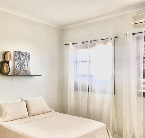 Llit o llits en una habitació de Syds Beach House