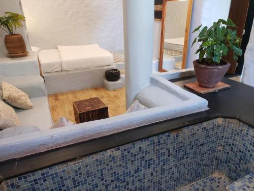a view of a swimming pool with a table at Achalaa Resort in Kolhapur