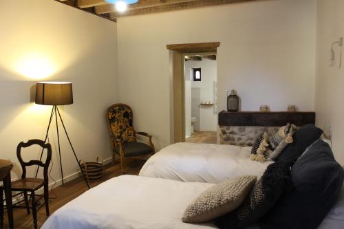 Posteľ alebo postele v izbe v ubytovaní LE DOMAINE DU PETIT TERTRE - SPA EN EXTERIEUR