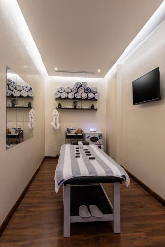 a room with a bed in the middle of a room at Blue Diamond Hotel Jeddah in Jeddah