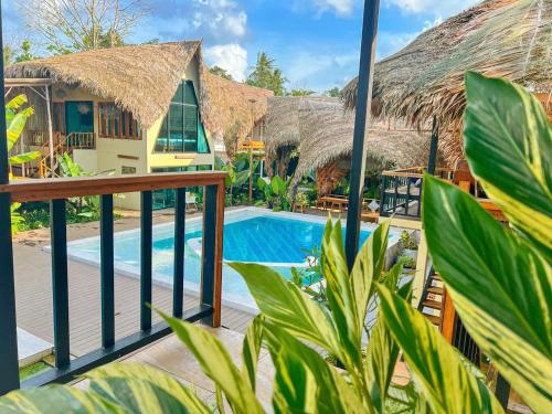 a view of a resort with a swimming pool at Varni Homestay in Phatthalung
