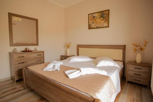 Postel nebo postele na pokoji v ubytování Nikorina apts