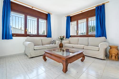 a living room with two couches and a coffee table at Coma-ruga in El Vendrell