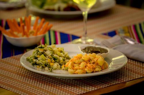 a white plate of food on a table at Ocean Forest Ecolodge in San Pedrillo