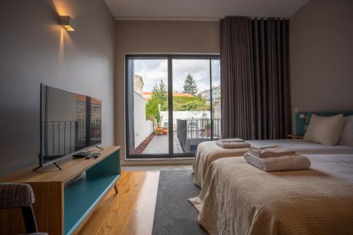 Ένα ή περισσότερα κρεβάτια σε δωμάτιο στο Oporto Trendy Formosa