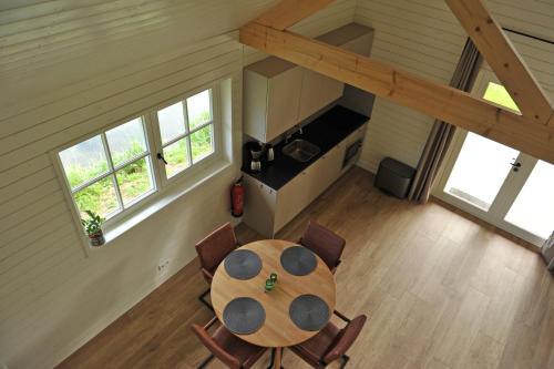 an overhead view of a table and chairs in a room at Lodges near the Rhine - Sustainable Residence in Hazerswoude-Rijndijk