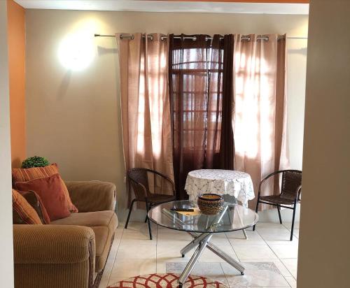 a living room with a couch and a table at The Bey Bed and Breakfast in El Socorro