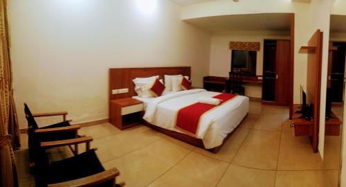 Una cama o camas en una habitación de Pearlspot Hotel