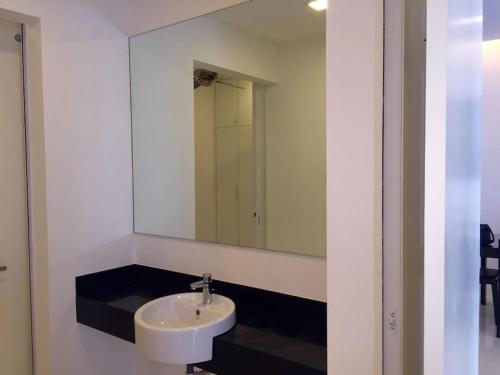 a bathroom with a sink and a mirror at Tropicana Avenue B32-09, Petaling Jaya in Petaling Jaya