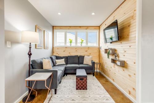 a living room with a couch and a table at Walk Score 90!!-Historic Downtown District-2 Blocks to Famous Forsyth Park-FREE Private Parking-Huge Private Patio in Savannah