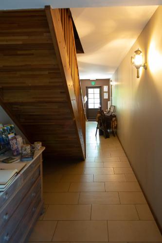a hallway with a staircase in a house at Guest house Western-city in Chaudfontaine