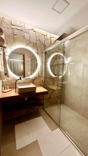 a bathroom with a sink and a mirror at Pousada Kiriri in Itarema