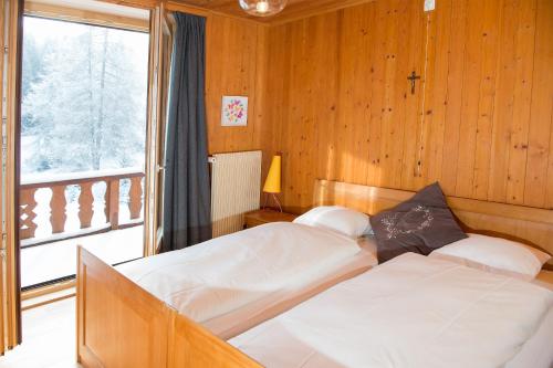 Postel nebo postele na pokoji v ubytování Residence for 12 persons Chalet Crestas-Lenzerheide