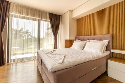 Posteľ alebo postele v izbe v ubytovaní Open Sea Residence