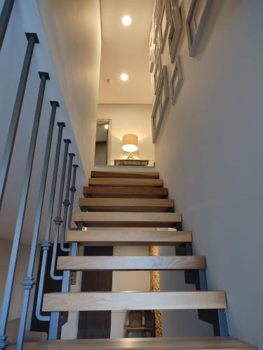 a staircase leading up to the second floor of a building at Raízes Turismo Rural in Castelo Branco