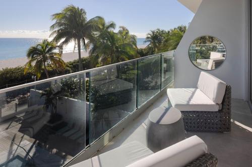 a balcony with a view of the beach and the ocean at MB Hotel, Trademark Collection by Wyndham in Miami Beach