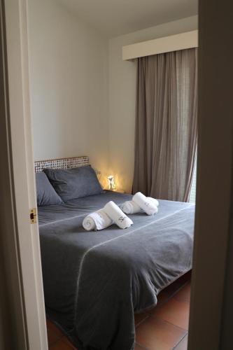 Ένα ή περισσότερα κρεβάτια σε δωμάτιο στο SATUNA BEACH CASA