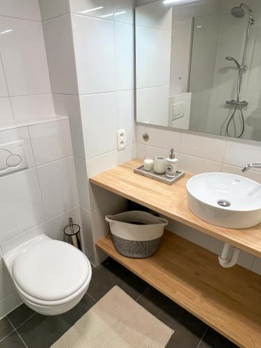 a bathroom with a toilet and a sink at Casa Casino Oostende in Ostend