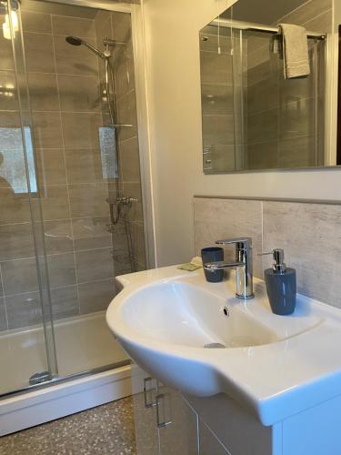 a bathroom with a sink and a shower at Black Bull Barn in Kirkby Stephen