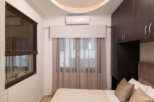 Postel nebo postele na pokoji v ubytování Pasiphae Lux Apartment Downtown
