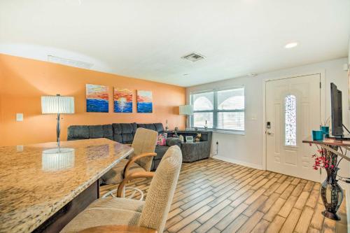 a kitchen and living room with a table and chairs at Sun-Soaked Hudson Getaway with Canal Access! in Hudson