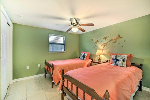 a bedroom with two beds and a ceiling fan at Sun-Soaked Hudson Getaway with Canal Access! in Hudson