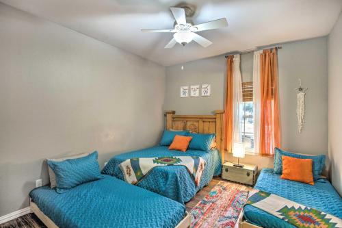 a bedroom with two beds and a ceiling fan at Lakefront Little Elm Home with Private Pool! in Little Elm