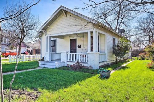 a small white house with a porch and a yard at Georgetown Vacation Rental Close to Town Square! in Georgetown