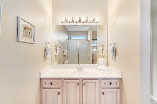 a bathroom with a sink and a mirror at Beach Haven by Meyer Vacation Rentals in Gulf Shores