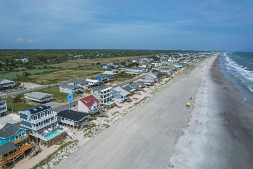 an aerial view of a beach with houses and the ocean at Somewhere on a Beach in Oak Island
