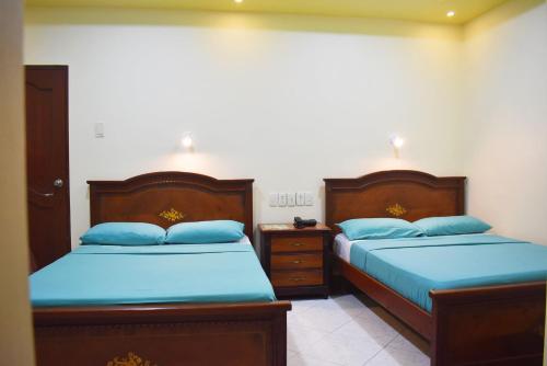 Katil atau katil-katil dalam bilik di Hostal Galápagos - Guayaquil