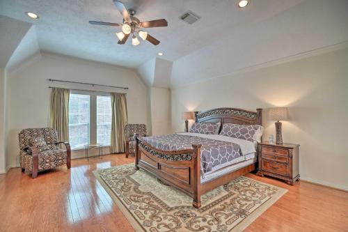 a bedroom with a bed and a ceiling fan at 2,500 Sq Ft Townhome - Walk to Central River Oaks! in Houston