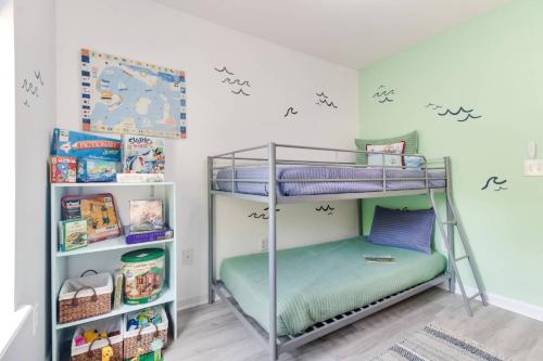 a bedroom with two bunk beds in a room at The Hairy Crab in Oak Island