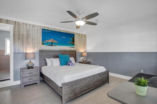 a bedroom with a bed and a ceiling fan at Seascape Resort & Marina in Marathon