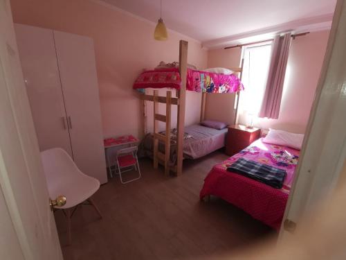 Двухъярусная кровать или двухъярусные кровати в номере Oferta!! Casa Lago Rapel - Punta Verde