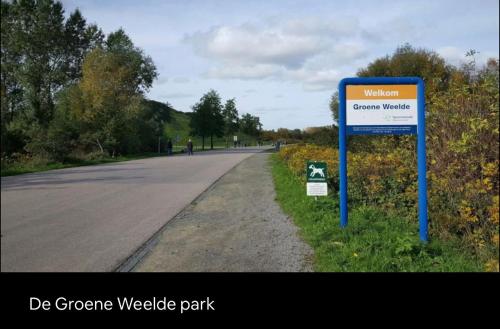 a sign on the side of a road at Wellness bungalow with jacuzzi &sauna&private garden near Amsterdam in Vijfhuizen