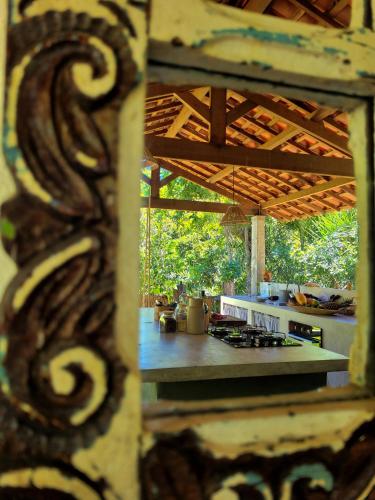 a view of a kitchen with a counter top at Na Floresta Glamping in Pôrto de Pedras